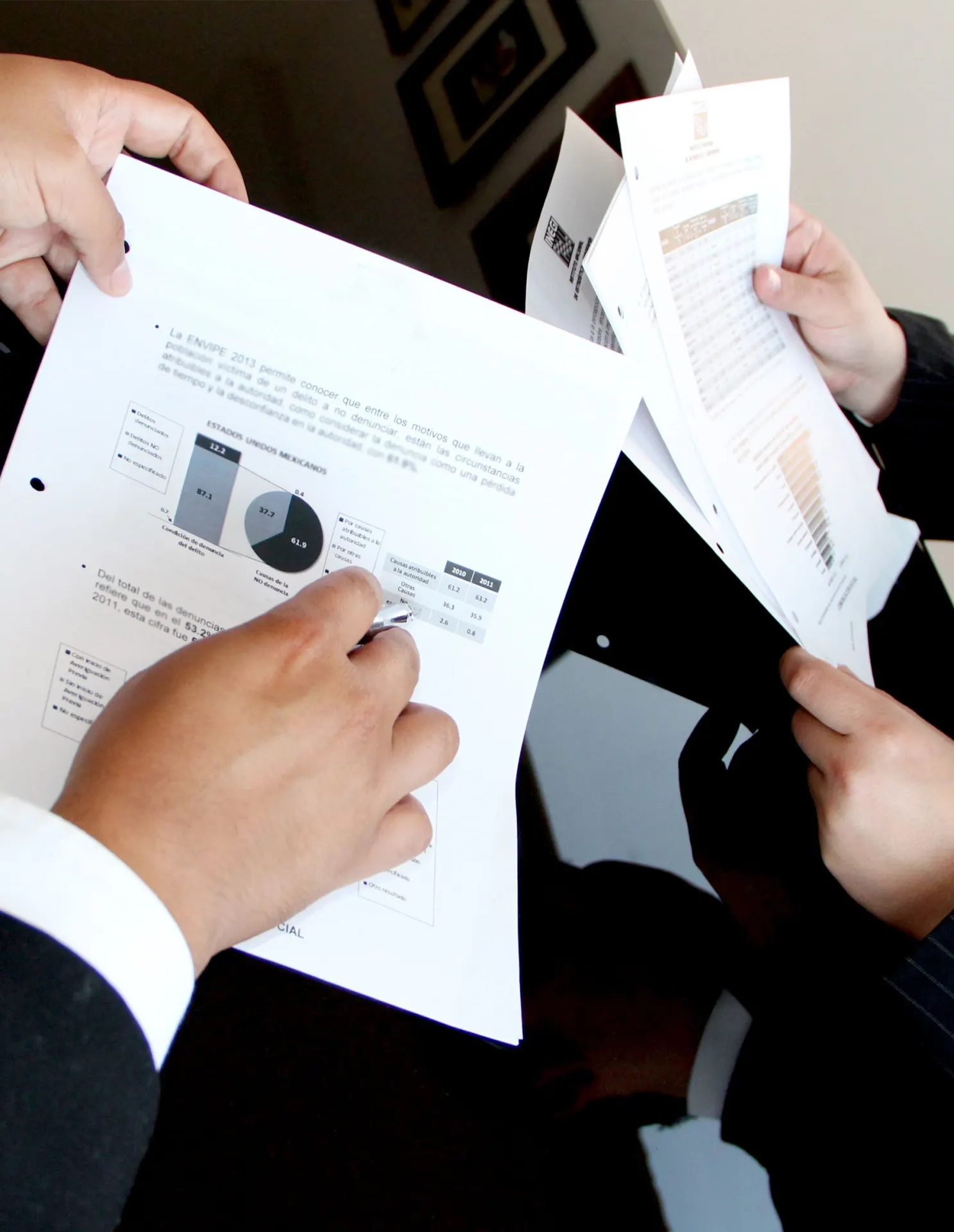 Consultants reviewing business reports