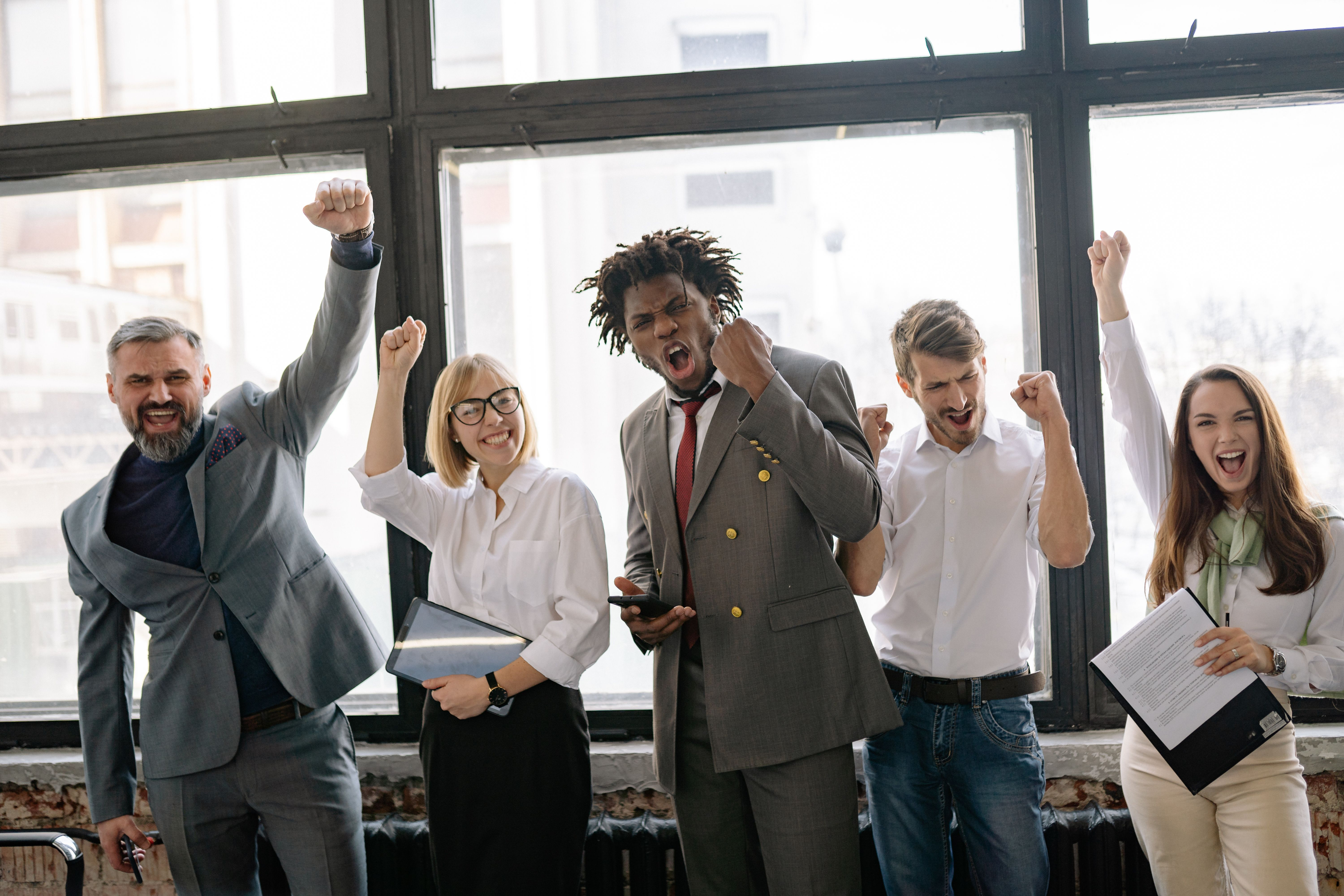 Professionals celebrating career success