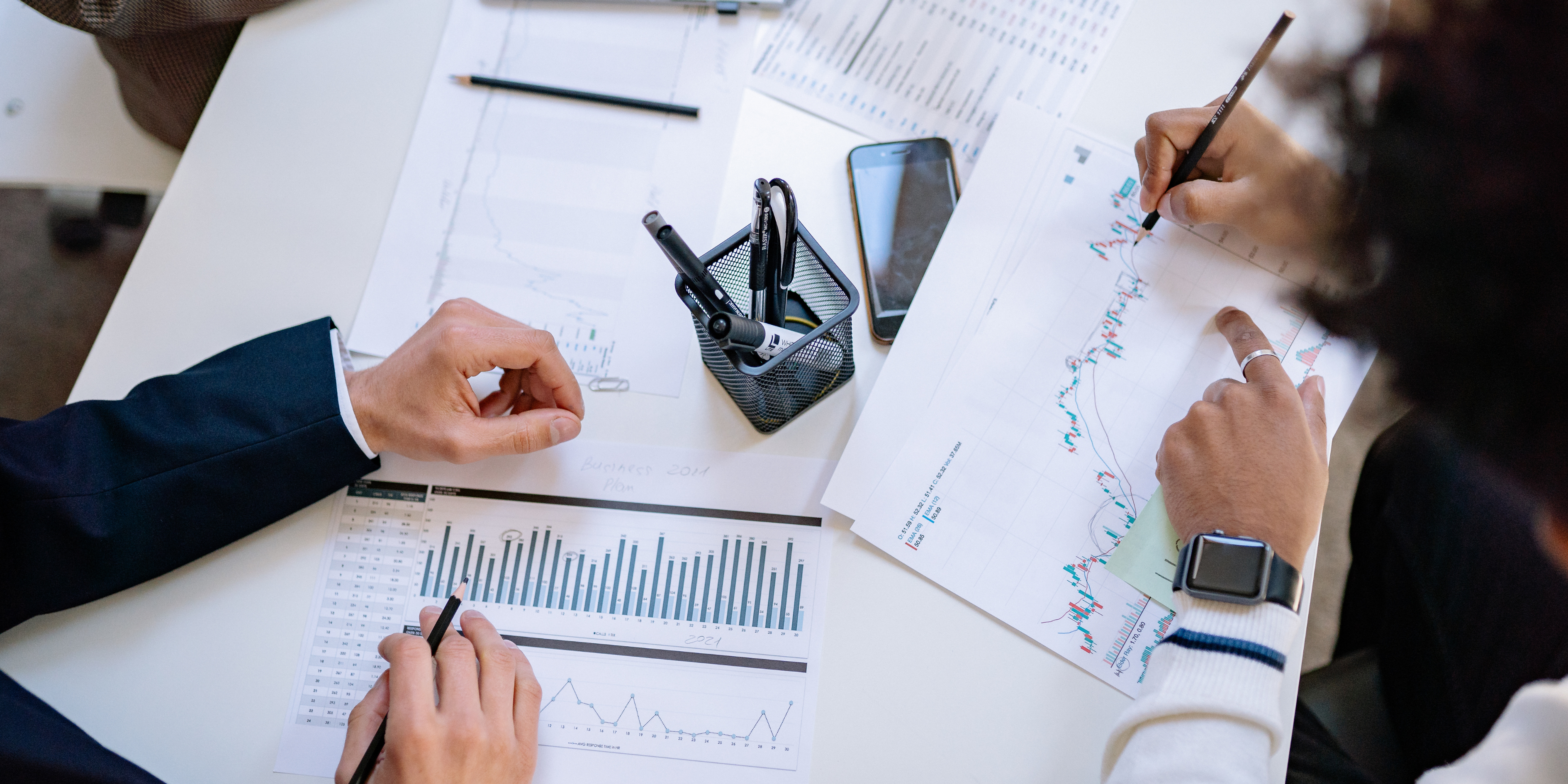 Financial consultants reviewing business reports
