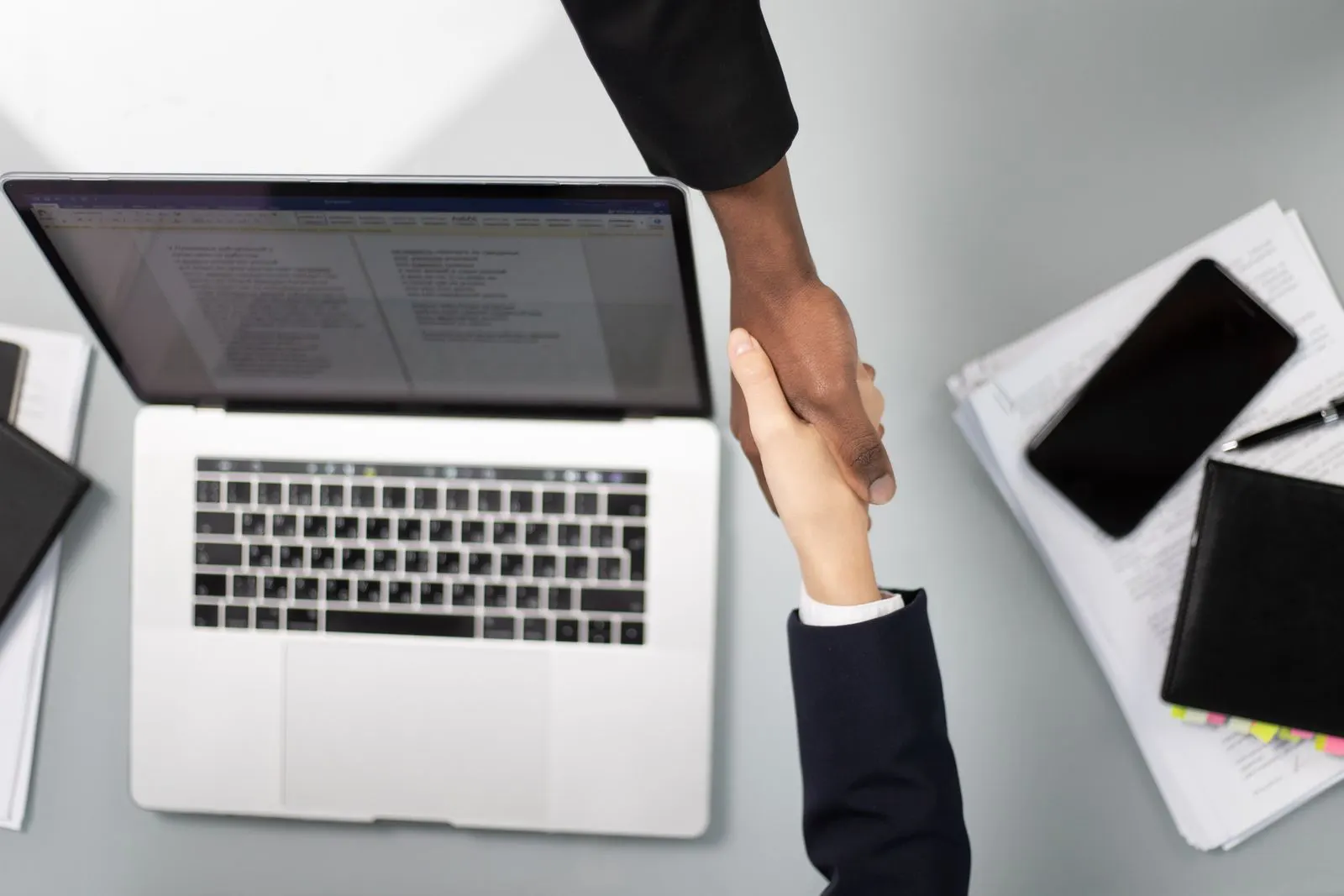 Professional handshake during a staffing discussion